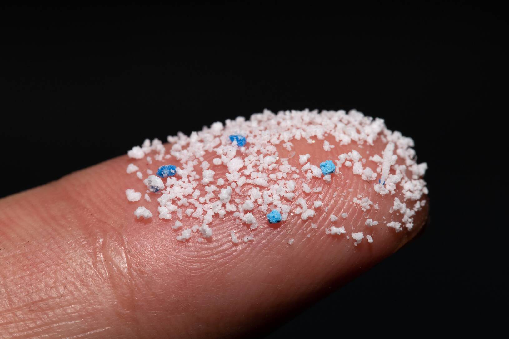 Microplastics on a finger